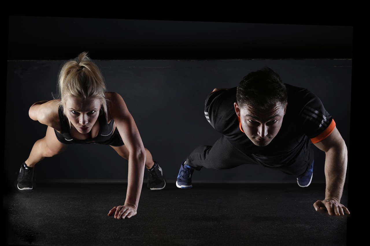 Man, woman, push-ups — Dr. James Morales: Pioneering Injury Prevention and Personalized Athlete Rehabilitation